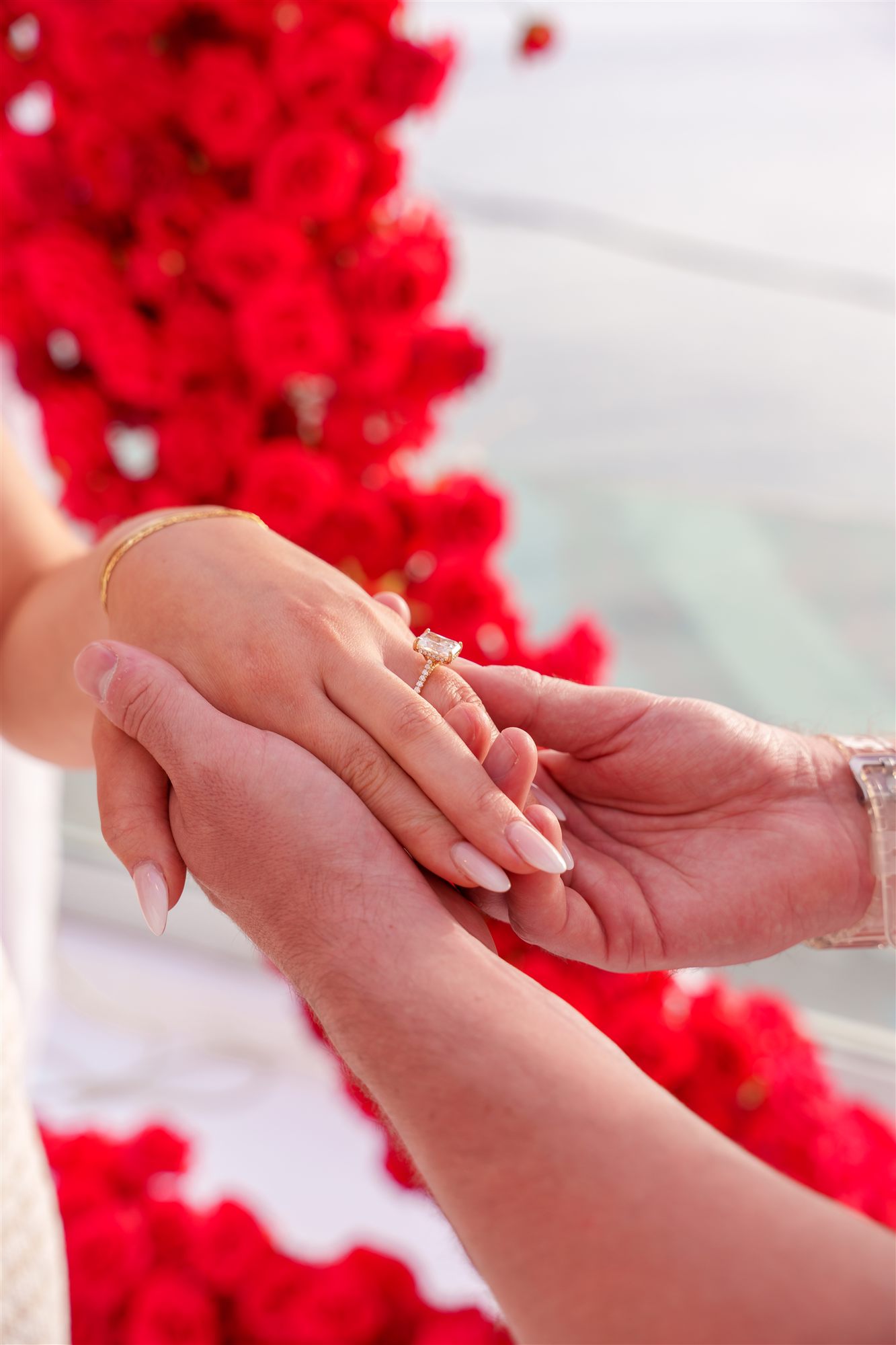 engagement ring close-up in front of the red rose heart at AION