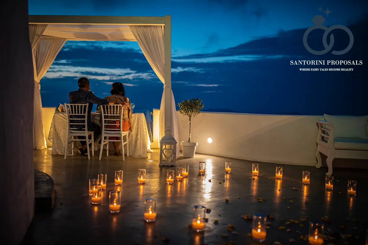 Wedding proposal dinner table set for two in Santorini