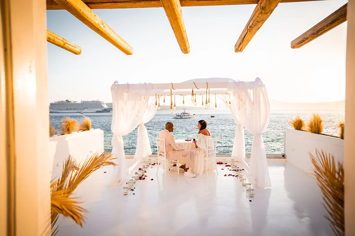 Private dinner proposal table overlooking the Santorini caldera