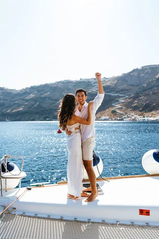 Santorini boat proposal celebration