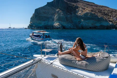 Santorini catamaran relaxing cliffs