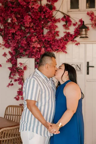 Santorini proposal bougainvillea kiss