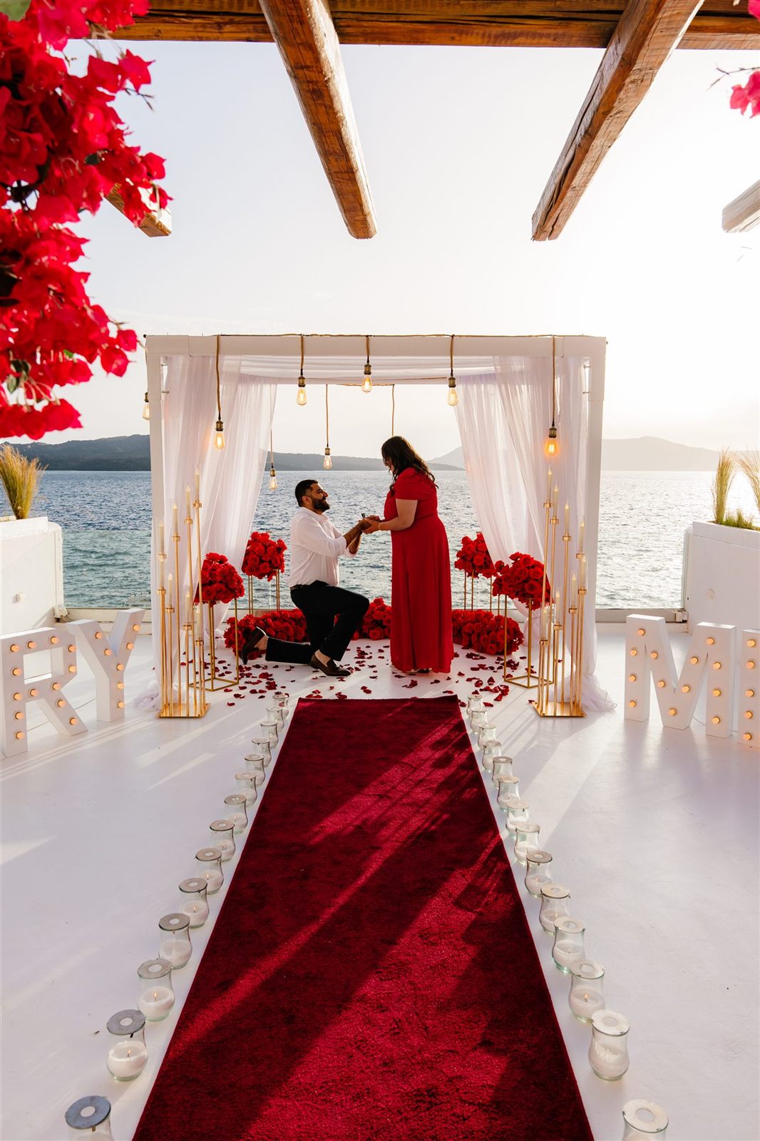Santorini proposal red dress AION venue