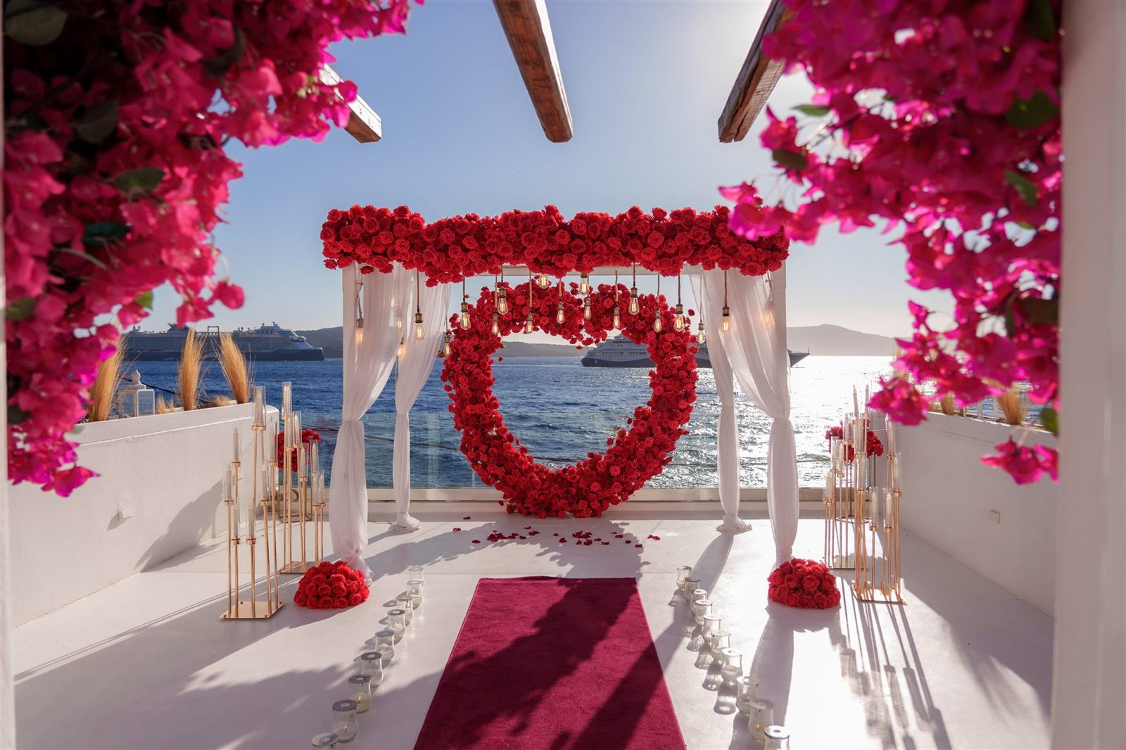 red rose heart wreath set-up at AION venue with a cruise ship passing behind