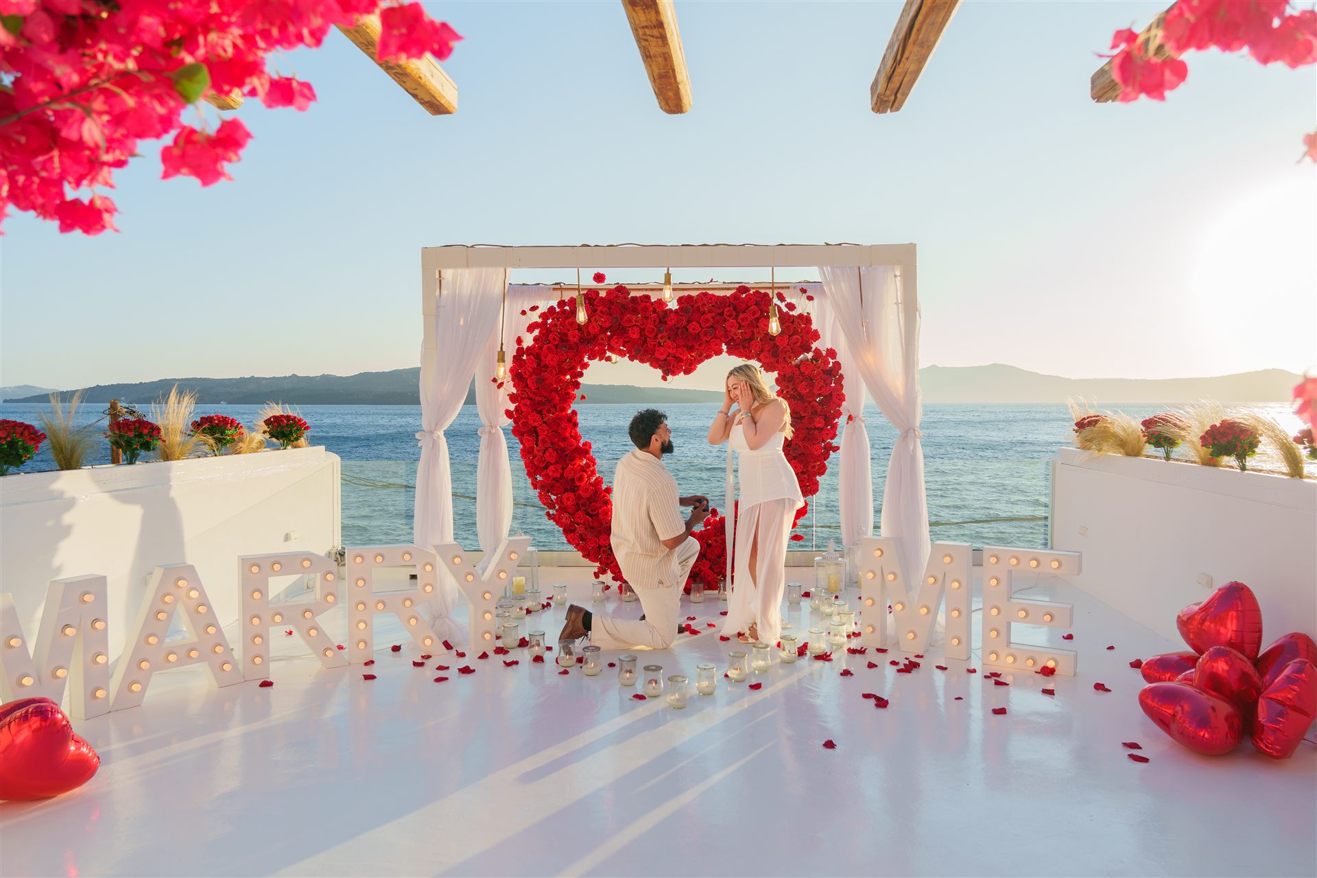 Red heart wreath and MARRY ME proposal at AION Santorini