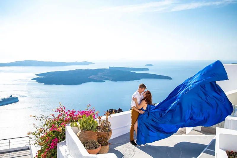 Oia proposal flying dress blue