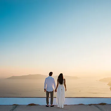 Couple at a romantic Santorini sunset proposal